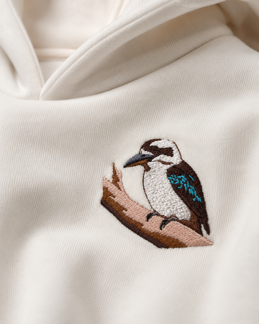 Close-up of the Laughing Kookaburra embroidery on The Wanderer hoodie