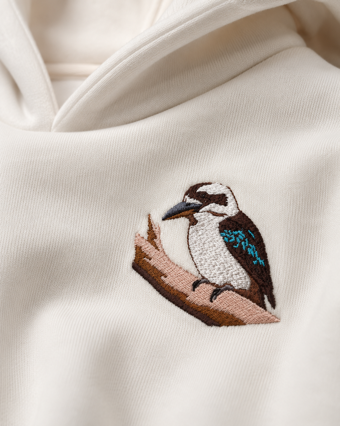 Close-up of the Laughing Kookaburra embroidery on The Wanderer hoodie